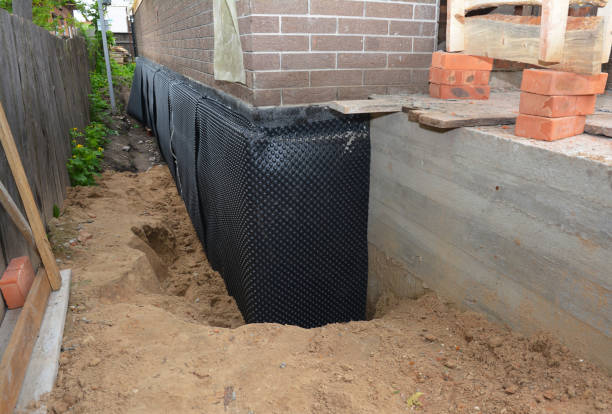 Happy homeowners after waterproofing job in Trumbauersville